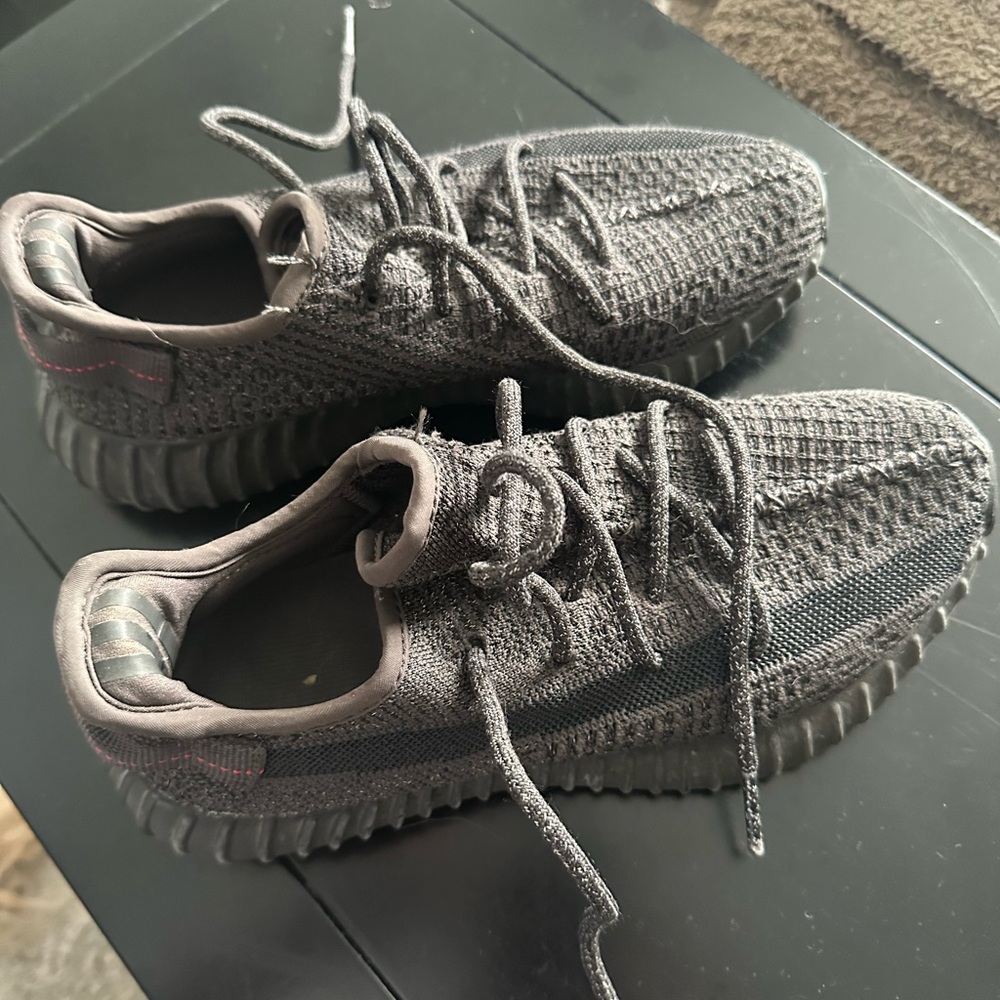Black Yeezy sneakers in size 8